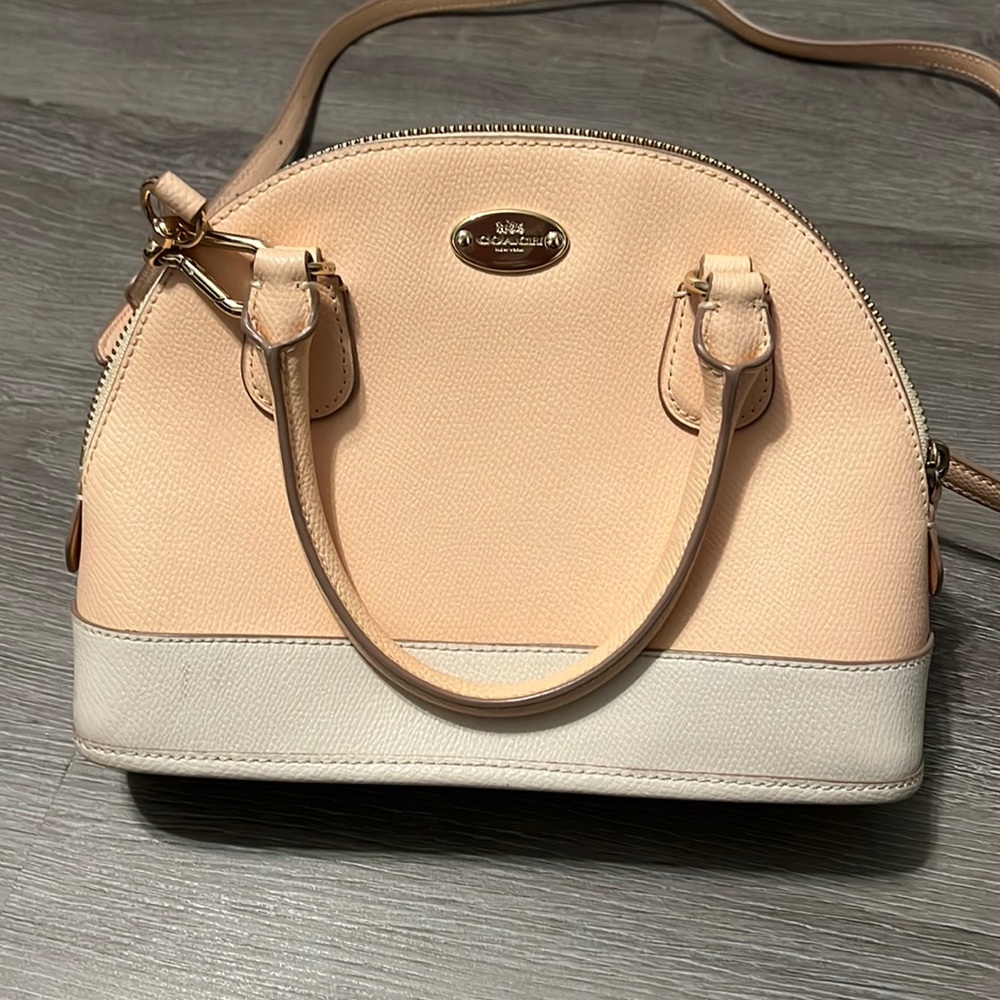 Coach pink and white crossbody purse